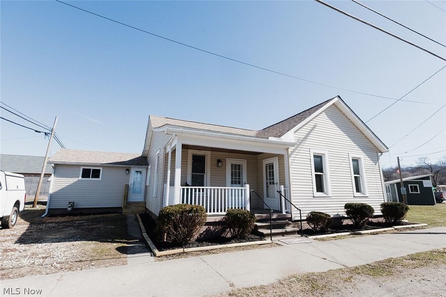 ALMOST BRAND NEW home now has 3 BEDROOMS and 2 FULL BATHS and SUPER CLOSE TO VILLAGE PARK!  This meticulous owner has renovated this one floor plan home to include a beautiful kitchen and dining area with breakfast bar, hickory cabinets (with lifetime warranty), newer stainless steel appliances, and Quartz countertops. A large living room allows plenty of room for entertaining.  The laundry area is conveniently located in the wide hallway near two of the bedrooms.  New roof, central air, ductwork and insulation in the attic, all new lighting, updated plumbing and wiring, new entry and storm doors, LVT flooring, plus beautifully stained woodwork and doors throughout.  3rd bedroom with high wood ceiling could be used as a family room. Gas stove, hot water tank, and newer gas furnace. Enjoy your morning coffee on the covered front porch while waving at the friendly neighbors going by.  Many high-end renovations will make you proud to call this your home.  Select your bedroom carpet with seller giving a carpet allowance with an acceptable offer.