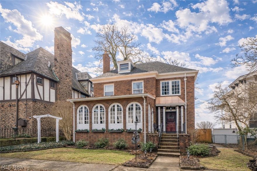 Welcome to 411 4th Street—an elegant brick home full of character in Massillon’s historic district. From the inviting brick front porch, step into a warm and welcoming foyer with tile flooring, a built-in bench, and timeless architectural charm. The main level offers beautifully flowing living spaces, including a spacious living room with hardwood floors, a gas fireplace, and built-in bookshelves and cabinetry, plus a bright sunroom lined with striking arched windows and doors that creates the perfect setting for morning coffee, reading, or relaxing. The formal dining room is rich in style with its own gas fireplace and built-in cabinets, while the nearby hallway pantry adds convenient storage. The kitchen features tile flooring, stainless steel appliances, an adorable breakfast nook with distinctive brick accents, and access to the rear patio for easy everyday living and entertaining. A full bath with corner shower and first-floor laundry add flexibility to the main level. Upstairs, you’ll find three spacious bedrooms, an office that can be used as a 4th bedroom covered with windows, generous closet space in the hallway, and a full bath. The primary suite is especially impressive with hardwood floors, a gas fireplace that has tile surround of the chapters of the Works of Shakespeare, decorative ceiling detail, and dual closets. One of the secondary bedrooms also offers private access to a balcony. The finished third-floor carpeted loft provides even more versatile space. The lower level expands your options with a rec room, full bath, workshop area, bonus room potential, and utility space. With three fireplaces, classic details throughout, two furnaces, two central air units, and a fenced patio area, this distinctive home offers a rare blend of historic charm, space, and everyday comfort.