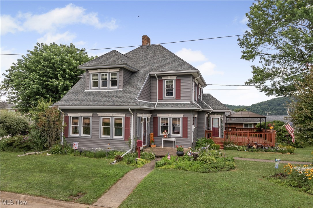 STOP!!! What a find in the city of Toronto. Historical home that has been restored & renovated by current owner. Home has lots of original ornate woodwork. Living room has decorative fireplace & hardwood floors. Full bath on main level off kitchen. Upstairs has 3 nice sized bedrooms & second full bath. Side deck off kitchen with lots of shade from the trees. Oversized 1 car detached garage that is heated & has water. Home sits on corner lot.