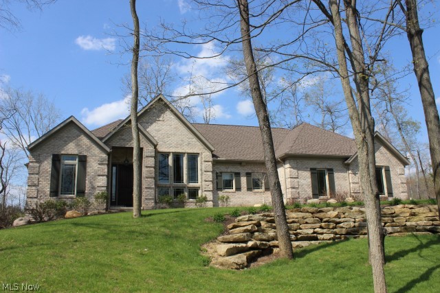 Gorgeous-inside & out! Architectural all brick ranch custom built 2011*Tranquil setting on lake w/1.48 acres offering 3 beds/2.5 bath & 2317SF (main level)*Quality built-volume ceilings, custom made cabinets w/roll out shelves thru out, granite counters, Poplar trim & 6 panel doors, crown molding, GE cafe series, stainless steel appliances, farm house hammered copper kitchen sink, Anderson vinyl low E windows, 30 yr dimensional shingles, Old Abbey jumbo brick*Vaulted great rm w/gas log frpl & window wall overlooking lake* Formal dining w/double trey detailed ceiling & flr to ceiling windows* Vaulted master w/glamour bath, walkin closet & slider to covered deck overlooking lake* Kitchen w/breakfast bar, walkin pantry & trey ceiling/light*Breakfast rm overlooking lake w/access to covered & open deck*1st flr laundry w/full counter, cabinets & utility sink*13 course unfinished walkout base w/poured walls and slider to covered brick patio*Stamped fire pit*25x26 side load garage*A rare find!