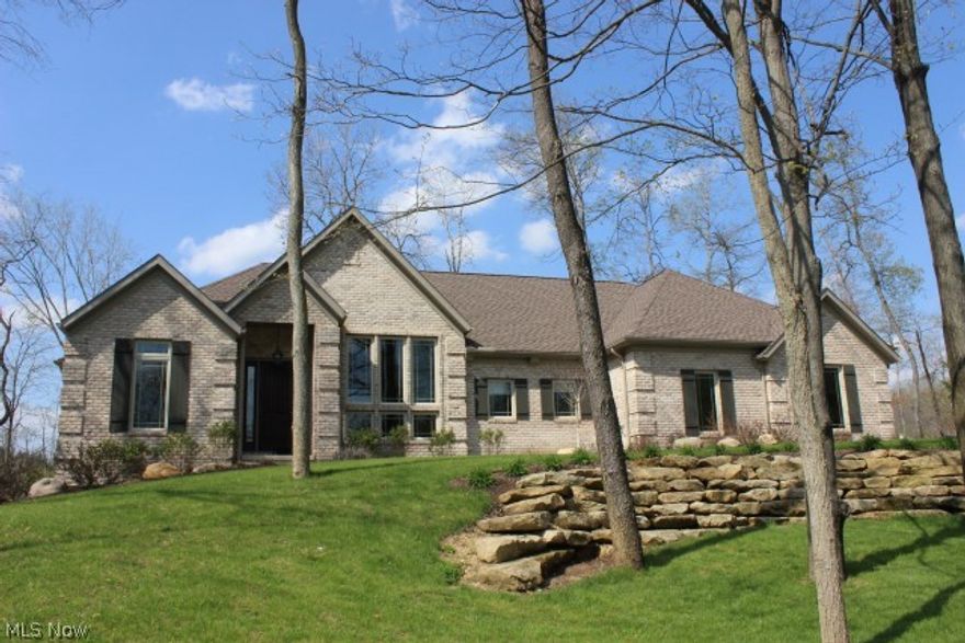 Gorgeous-inside & out! Architectural all brick ranch custom built 2011*Tranquil setting on lake w/1.48 acres offering 3 beds/2.5 bath & 2317SF (main level)*Quality built-volume ceilings, custom made cabinets w/roll out shelves thru out, granite counters, Poplar trim & 6 panel doors, crown molding, GE cafe series, stainless steel appliances, farm house hammered copper kitchen sink, Anderson vinyl low E windows, 30 yr dimensional shingles, Old Abbey jumbo brick*Vaulted great rm w/gas log frpl & window wall overlooking lake* Formal dining w/double trey detailed ceiling & flr to ceiling windows* Vaulted master w/glamour bath, walkin closet & slider to covered deck overlooking lake* Kitchen w/breakfast bar, walkin pantry & trey ceiling/light*Breakfast rm overlooking lake w/access to covered & open deck*1st flr laundry w/full counter, cabinets & utility sink*13 course unfinished walkout base w/poured walls and slider to covered brick patio*Stamped fire pit*25x26 side load garage*A rare find!