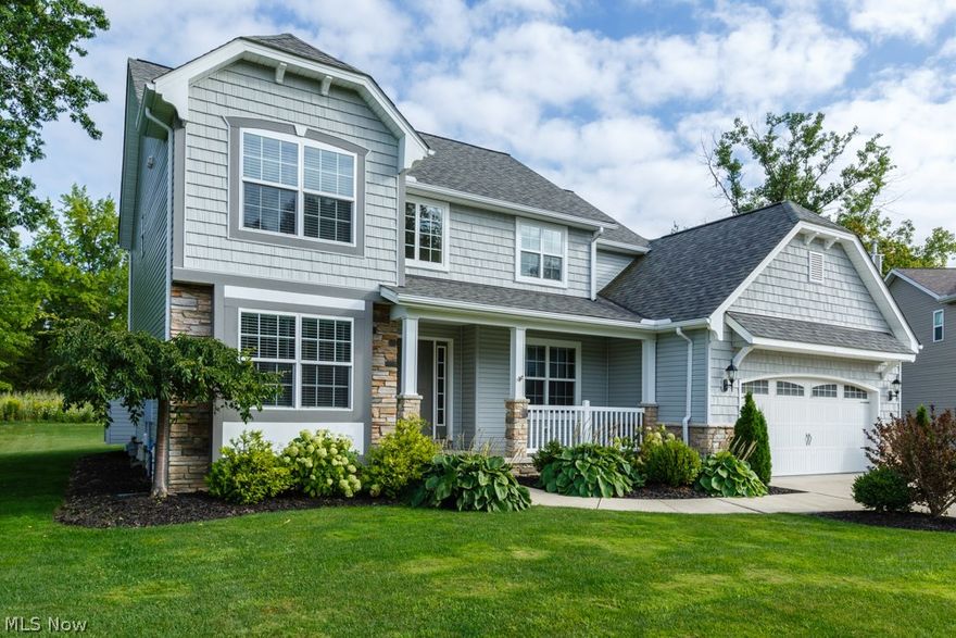 Beautifully appointed and welcoming this 4 bedroom vinyl colonial with stone front accents is on a Cul-de-sac lot. Front porch, 2 story hardwood foyer, dual oak staircase to upper level, unfinished basement, oak kitchen with breakfast bar, corner sink, large eat-in area and window seat and attractive recessed panel ceiling, wainscoting and tray ceiling in formal dining room, master bath with double sink and jetted tub, good size walk-in closet in master suite, security system, irrigation system, stamped patio, 2 car garage with work bench. Home warranty too!