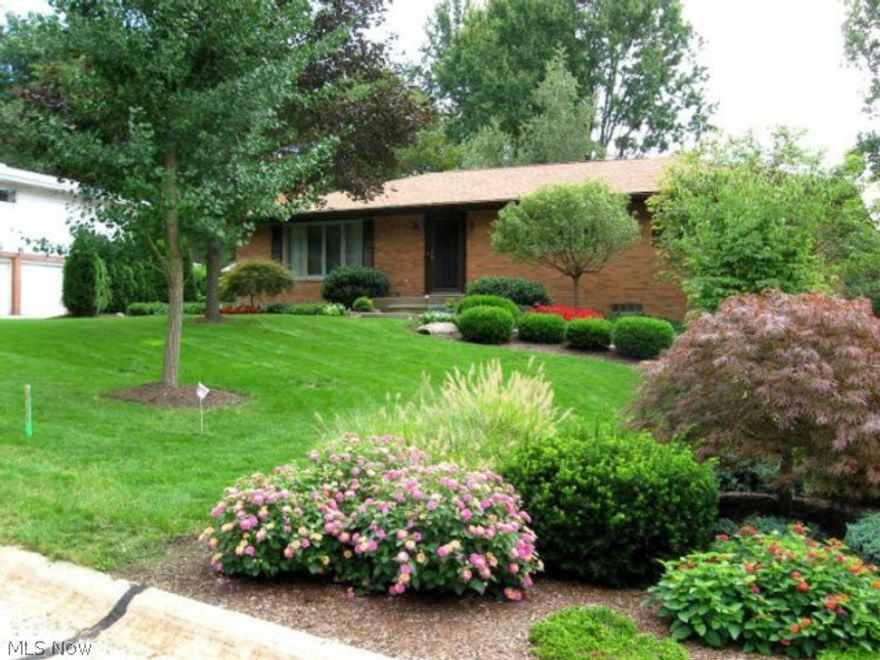 Beautiful Fairlawn Heights brick Ranch with 3 bedrooms and 2 full baths and one half bath.  The living room has a large picture window and updated fireplace.  The dining room and kitchen windows overlook a covered deck and fenced in wooded backyard. The front yard is professionally landscaped with large boulders, stones and decorative plantings.  New roof in 2011 and newer Andersen windows.  This home has been very well maintained and is in excellent shape.