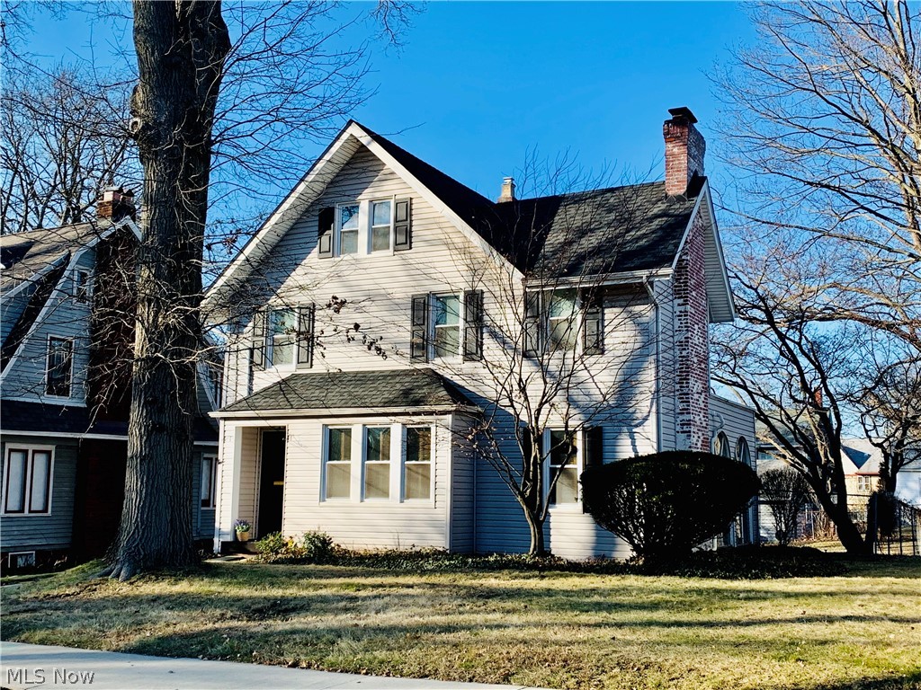 It'll be love at first sight with just one look at this gorgeous Colonial on a fabulous tree-lined West Akron street! Your dream home come true, this charmer has been lovingly maintained: siding, roof, windows and insulation have been installed. Perfect for entertaining or relaxing evenings at home, the spacious Living Room features crown molding, beautiful built-ins, a lovely wood mantle and decorative fireplace. Leading through an arched entryway, you'll find the ample formal Dining Room; crown molding graces this room and a large window overlooking the fenced backyard allows for wonderful natural light. An eat-in kitchen, half bath, foyer, and entrance to the 3 season Sun Room complete the main level. The second level features 3 bedrooms and the full bath. The roomy Master bedroom features multiple closets for abundant storage. A 4th bedroom in the finished attic features wood flooring and a comfortable sitting area. The finished basement serves as a great Rec Room with beautiful wo