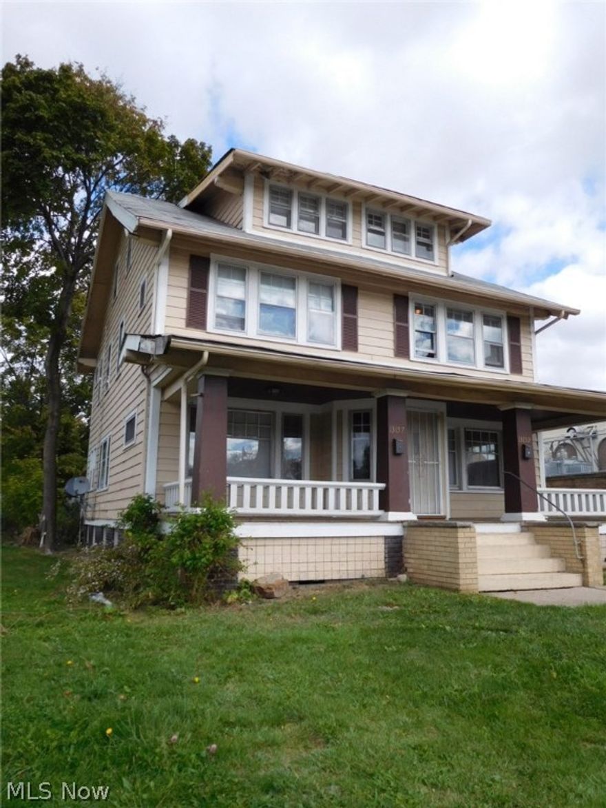 VERY large duplex with 4 bedrooms on each side and a 4 car garage. Hardwood floors throughout. Great location. Close to public transportation and amenities!!