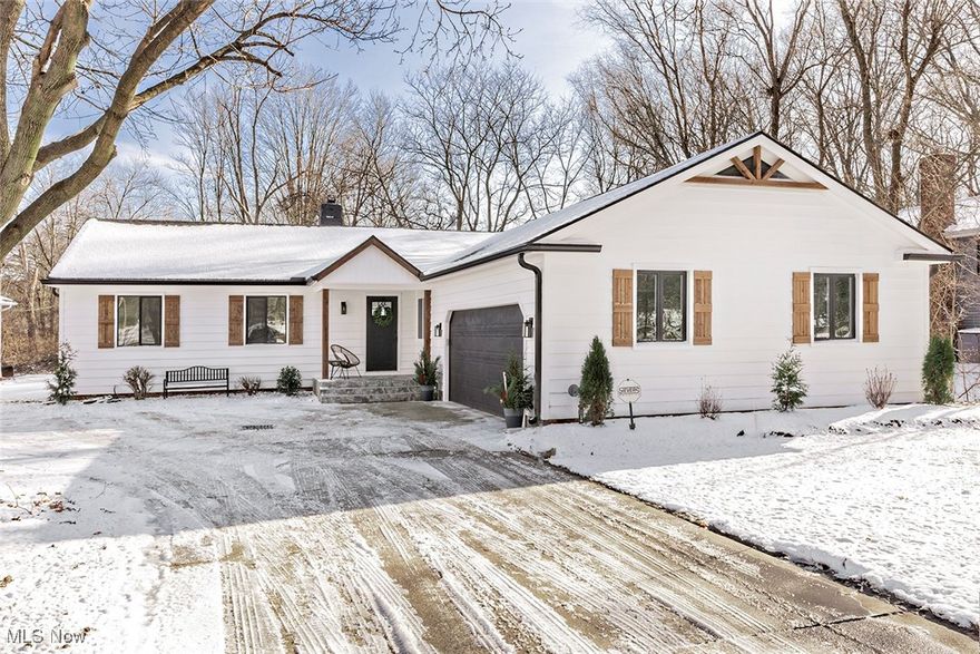 Impeccably remodeled 3-bedroom ranch showcasing a sophisticated open-concept design. The designer kitchen is appointed with quartz countertops, extensive cabinetry, updated appliances, and a sleek eat-up bar ideal for both casual dining and entertaining. The sun-filled dining and family rooms flow effortlessly together, anchored by a contemporary electric fireplace, while an additional living room provides elegant versatility. Step outside to a brand-new deck overlooking the backyard—perfect for seamless indoor-outdoor living. Notable upgrades include a main-level laundry room, attached two-car garage, brand-new roof, new windows, and exceptional attention to detail throughout. Truly pristine, move-in ready, and beautifully finished! Great condo alternative.