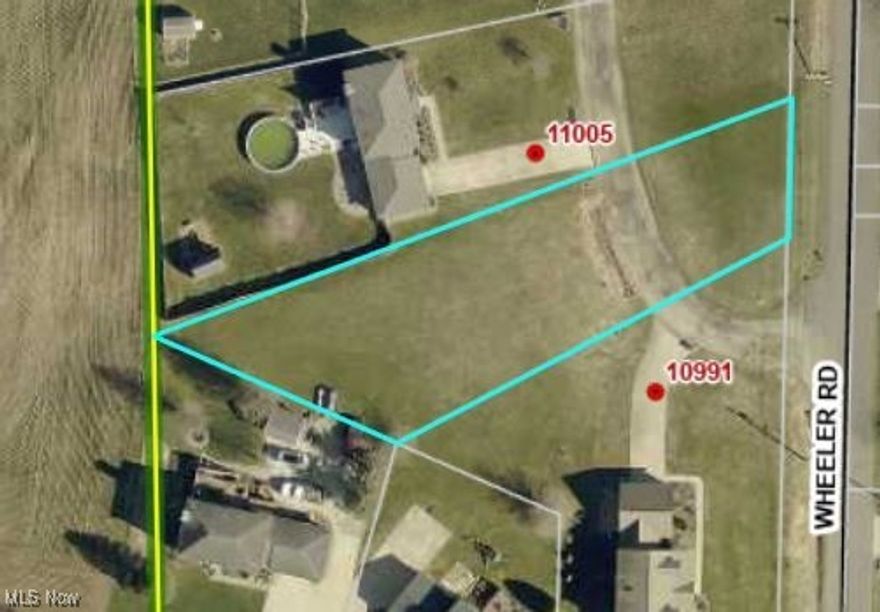 The secret is out - Garrettsville is a wonderful community! Restaurants, coffee shops, a movie cinema, grocery stores, all set within a scenic and historic area of Portage County. Often thought of as "too far away" from the bright lights and big cities, this gem of a community is just 30 minutes from Solon (with easy access to route 422) and Twinsburg (a straight drive via route 82). Garrettsville Village building lot available.  Public water, sewer, gas and electric available. This .431 acre building lot is awaiting your new home. Please contact agent for plat map and deed restrictions.  Located between 10991 and 11005 Wheeler Road.