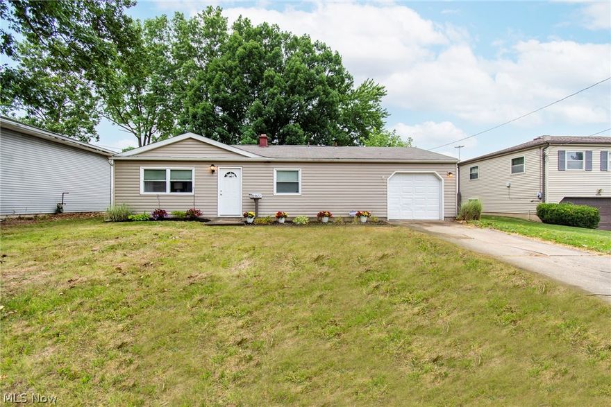 If you are looking for a home with close proximity to Austintown schools with the convenience of 1 floor living this is the home for you. From the fenced in backyard you can see the elementary and high school. This 3 bedroom home has fresh interior paint and new carpet in all bedrooms and living room. Bathroom has new vanity, lighting, paint and flooring. Fresh landscape in front with reseeding in partial  part of yard. Newer roof and new electrical in garage. Laundry hookup is located in hall between kitchen and attached 1 car garage that also makes a great mudroom.  This is a slab home so no basement issues to worry about. Home also has Central Air. Home has been rented out for the past year at 1200 a month making  this a great single floor owner occupied home or  potential a great investment property.