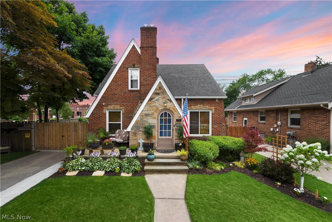 Welcome to this charming 1941 Cape Cod in sought after West Park. The stone & brick exterior, manicured landscaping, steep roof peaks, and arched front door make an inviting first impression. The freshly refinished gleaming hardwood floors welcome you into the spacious main living room with stone fireplace, large windows, and white crown molding. This space is directly attached to the formal dining room for seamless entertaining. The kitchen space has been thoughtfully renovated with white cabinetry, new appliances, and granite countertops. Also situated on the main level is a half bath/powder room. The 1940’s charm continues on the second floor and comes through in details such as the brass doorknobs, solid wood doors, and vintage black & white tiled primary bathroom. Both bedrooms are roomy & full of natural light. The wood paneled basement has its own fireplace & is a great extension of the upstairs entertaining space. This could serve as a great place to assemble a secondary living