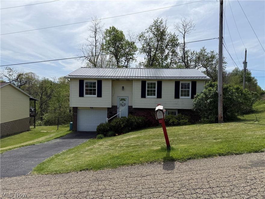 Welcome to this beautifully updated split-level home featuring a brand new roof (April 2026) and a new deck ( April 2026) —perfect for outdoor entertaining and offering peace of mind for years to come.
This home offers 3 bedrooms with the potential for a 4th bedroom, providing flexibility for a home office, guest space, or growing household. step inside to a stylish, move-in ready interior that blends modern updates with everyday comfort. The updated kitchen is a standout, showcasing sleek white cabinetry, stainless steel appliances, a farmhouse sink, and a striking tile backsplash that adds both texture and character.  The fully remodeled bathroom features contemporary finishes, a glass-enclosed shower, and a clean, modern design. The inviting living area is filled with natural light and complemented by warm flooring and a functional layout, creating a comfortable and open feel. Neutral tones throughout make it easy for any buyer to personalize the space.
