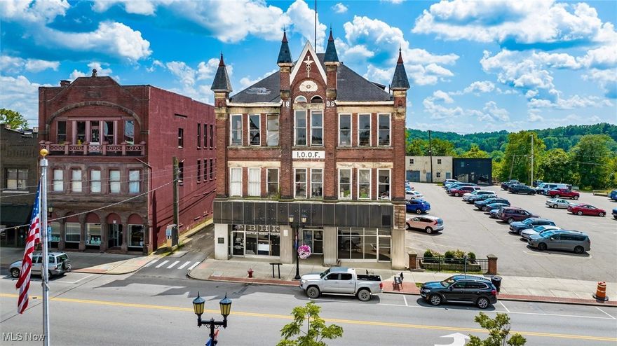 Step into a piece of Downtown Cambridge history with this iconic building, formerly known as Pavlov’s Music Center and the International Order of Odd Fellows Cambridge Lodge No. 301. This prominent property offers unmatched visibility, character, and potential. 2 commercial retail spaces on the street level and projections of 8 residential units on the 2nd and 3rd levels. Both commercial spaces are now vacant but previously unit a (alley side) rented for $850 per month and unit b (parking lot side) rented for $600 per month. Traffic count is over 6,200 per day. Perfect location on Wheeling Ave., at the entrance of downtown Cambridge near Theo's restaurant and Black Cat Vintage. Historical marker #624 hangs on the front of the building recognizing the site as the location of the “Tingle Tavern”, which was Cambridge’s first tavern and also where the first government of Cambridge was organized, in 1810.