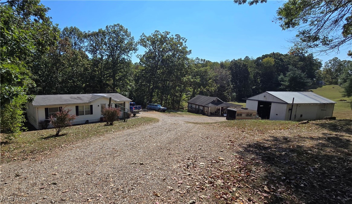 Located just minutes from town, this 1995 model double wide sits on a spacious 1-acre lot with city water and sewer. The home offers a functional layout and basic amenities, though it could use some TLC.
This property also includes a large, detached garage/shop that was previously used for mechanic and auto body work. The shop includes a car lift and has plenty of space for tools, projects, or storage. The shop offers great potential for the right buyer.
Perfect for someone looking for a property with utility and room to grow.