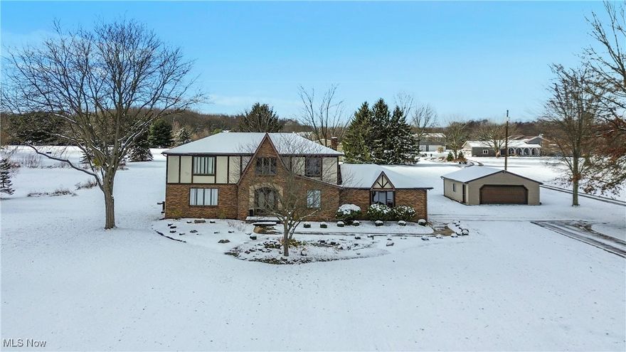 Experience country living at its finest in this spacious 4-bedroom, 2.5-bath detached home set on over 5 acres. Featuring an impressive 2-story foyer and open staircase, this property boasts an eat-in kitchen with custom maple cabinets, large pantry, stainless steel appliances. Enjoy gatherings in the formal living and dining rooms with elegant hardwood floors, or relax in the family room in front of the stacked stone fireplace. The sunroom and adjoining deck provide the perfect spaces for outdoor entertaining. The first floor also includes a convenient office, half bath, and laundry room. Upstairs, you'll find four bedrooms—including a primary suite with hardwood floors—plus a full bath with a separate vanity area and closet. The main bath offers double sinks and ceramic tile. Parking and storage are abundant thanks to a 2-car attached garage, an additional 24x30 garage equipped with 220v wiring for a welder or compressor, and a spacious 40x30 pole barn. Don’t miss your opportunity to own this incredible home!