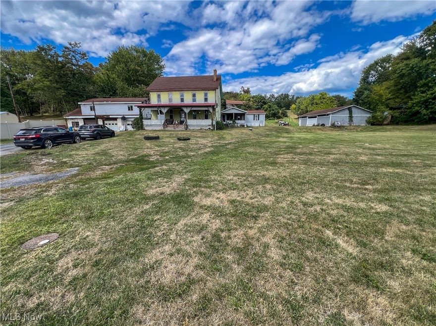 7+ bedrooms, 4 Bathrooms, over 4,100 sq ft of living space, detached 3-car garage with a workshop & a second-floor carpenter shop, detached 50'x32' pole building with two garage doors, and a two-story barn all on 5.41 acres. The two full bathrooms in the farmhouse have been completely remodeled! Window World replaced the windows. The hot water tank and the gas furnace were installed in 2024. The electrical service and breaker box were installed in 2025. The main floor of the farmhouse offers two bedrooms, a kitchen, a dining room with built-ins, a full bathroom, and a vast living room consisting of 704 sq ft with a fireplace. Upstairs, the home has a small kitchen, living room, full bathroom, and two bedrooms. The rear addition was added as an in-law suite. The in-law suite has three bedrooms, two bathrooms, a living room, a kitchen, a dining room, a laundry room, and front & back decks.