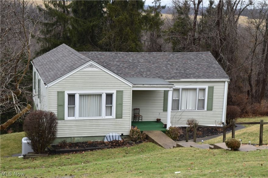 SELLER LOOKING FOR AN OFFER. Cute home in a relatively private location without close neighbors. Home is in relatively good condition and has 3 bedrooms, 1.5 baths, and the kitchen in the basement. Nestled in a nice setting with woods behind the home. Owner state there is an additional 4 acres that can be purchased, price is negotiable.