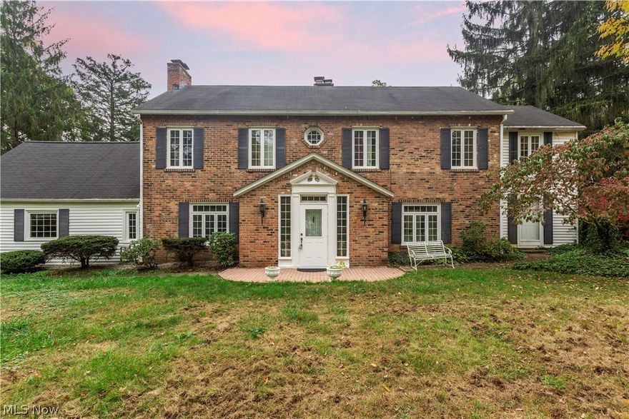 Stately colonial in Gates Mills. Through the large front door you are welcomed home by a cheery entry with brick tile floors. To the left is the large kitchen and dinning room with charming brick fireplace accent wall, large kitchen island and wood ceiling beams. Adjacent is a full bathroom and access to the laundry and garage. On the other side of the entry is the living room with gleaming hardwoods, wood ceiling beams and access to the backyard brick paver patio. Stunning wood paneled study with leaded glass built ins for all your books and treasures. Upstairs you'll find 3 bedroom and 2 additional full baths. The master suite features an accent wall with French style built ins, fireplace and large ensuite bath with a large soaker tub. 2 car garage.