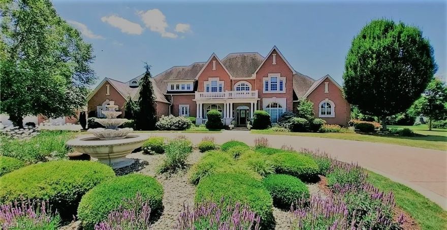 2 story custom and very modern home on a beautiful private, gated 6.6 acres.  Quality finishes, very open soaring ceilings and storage space abound in this 5 bedroom, 4.5 bath home with over 6100 square feet plus a full unfinished basement with 12' ceilings, 3 story elevator, 4 car garage plus a detached 72x36 garage with 3 bay parking heated and cooled, 2 bay setup with concrete walls for washing cars, indoor basketball court and meticulous landscape/hardscape.