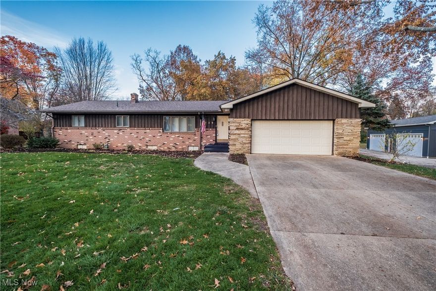 Best buy in Jackson Township that is truly an exceptional property with nearly 1 acre and priced to sell! This sprawling brick ranch offers significantly more space than its exterior suggests, featuring over 2400 square feet of first floor living space at its finest. The home boasts two impressive rear additions. The first is a huge primary suite, complete with a grand entry hallway of extra closet space, extra natural light with sliding door wall and a large glamour bathroom featuring separate vanities, large garden tub, separate shower, and a spacious walk-in closet. The second addition includes a first floor laundry, full bathroom and great-room with vaulted-knotty pine ceiling, window wall, skylights and access to a wrap around deck.  The great room/family room also includes a gorgeous gas fireplace with stone & wood accents. Quality built home with good bones and offers even more living space in the finished lower level, which features a recreation room with a bar, office/den, storage room and a 4th bedroom or workout/craft room.  Beautiful kitchen with extra cabinetry, breakfast bar and superior appliances. Over sized living room and dining room, three full bathrooms and  move in ready!  Furnace new 1/2020 with 10 yr warranty, C/A new 9/2025, Roof and skylights new 10/2025 and garage floor professionally coated 6/2023 (4k). This is a must-see property that perfectly combines comfort, space and is convenient to everything; 77, CAK, Shopping Mall, Restaurants, Banking and more. Gas heat and city utilities.