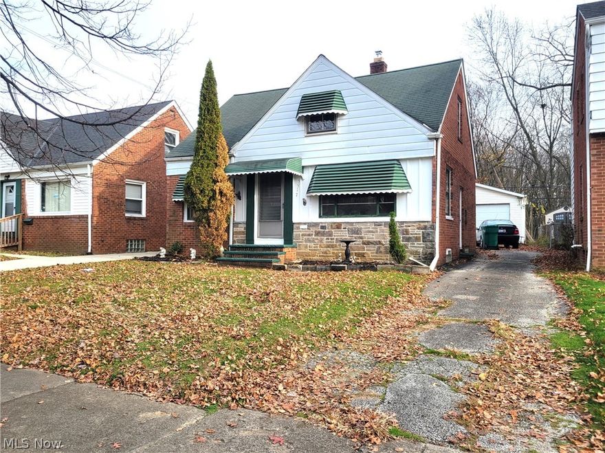Attention Investors and Flippers! This 3-4 bedroom bungalow with stone and brick exterior is ready for you, Easy to show! Features hardwood floors in living room and 2 bedrooms down. Kitchen has eating area and access to the enclosed porch on rear. Upstairs has nice sized dormer and den/office or possible 4 bedroom. Full basement has glass block windows and circuit breaker box, hot water tank replaced 2013. Nice rear 2 car detached garage. Point of sale has been ordered and in process, buyer to buy in "as is" condition and assume violations. Ready for offer!