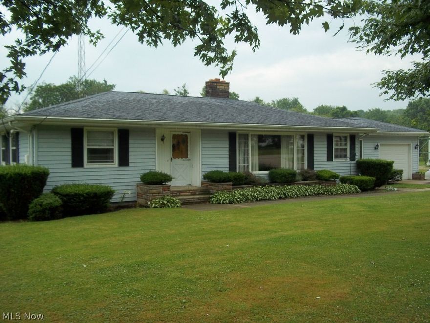 Adorable property that is well laid out with the basement being accessible to the back yard and has a living area complete with kitchen, bathroom, bedroom/office, and workshop with garage door access. The main level is also very comfortable and consists of a large living room with fireplace, 3 bedrooms, and a bath. The back yard has a large storage shed and a creek at the rear line. Close to I-90 and shopping. This one won't last long.