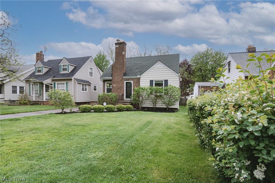 Move right into this charming and tastefully updated cape cod on a desirable street in Euclid! The front door opens into the bright and sunny living room with hardwood floors. The kitchen features granite countertops, newer cabinetry, durable ceramic tile flooring, and a full complement of appliances. Two bedrooms with hardwood floors and ample closet space are located down the hall. An updated full bath with a lovely tile shower surround completes the first floor. Upstairs there is a third bedroom, also with hardwood floors, plus a nice landing with charming built-in shelving and drawers. The partially finished lower level features a spacious rec room with a fireplace. The laundry/mechanicals area is clean and tidy and includes a bonus shower and toilet that could easily be turned into a full bath! Glass block windows were recently installed throughout the lower level as well. Outside, a lovely back porch overlooks the fully fenced backyard, plus there is private beach access via an e