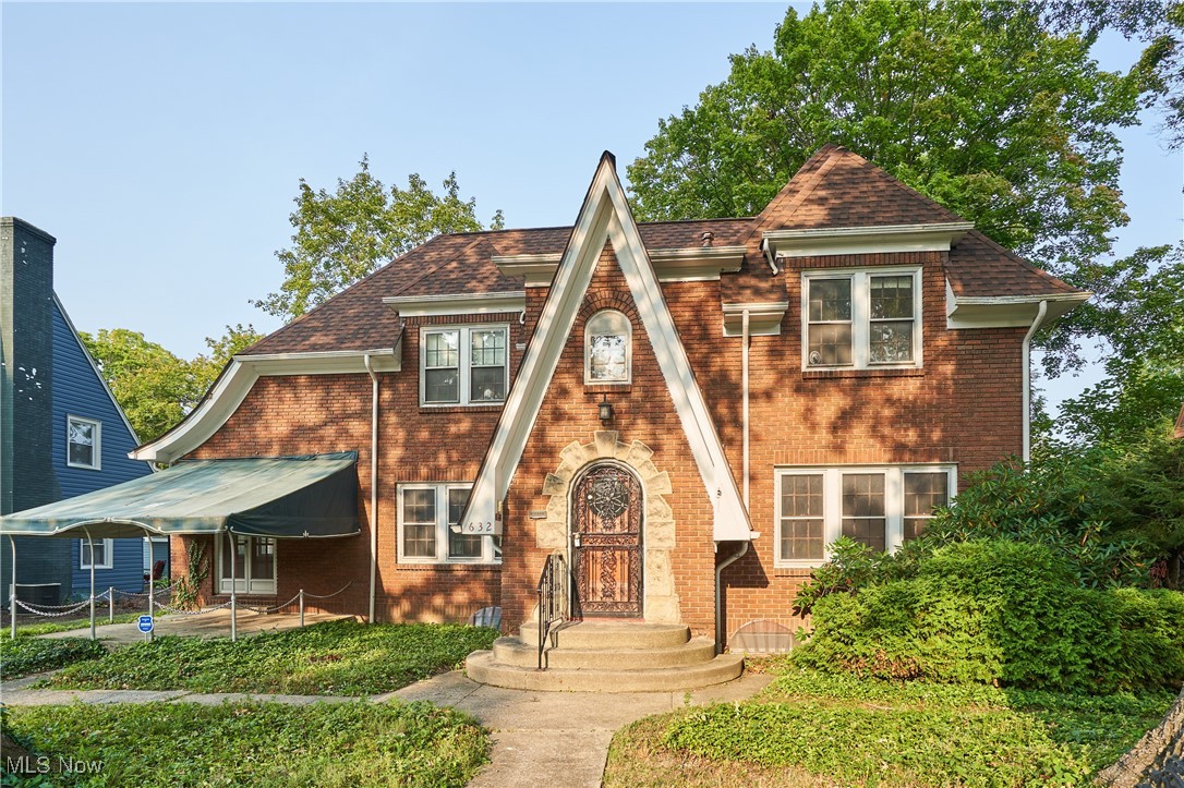 Old world charm in this all brick home- Starting at the roof line- With a steep weeping gable at the entrance to french doors leading to a front patio with a canvas canopy!!The round wood front door welcomes your guest into a tiled floor foyer and round arches leading to Living room and Formal Dining.The Living room has a fireplace with gas and a white mantle. The sun room is at the end of the large living room and also is accented with rounded arches. The sun room has french doors that leads to the cover front patio. The formal dining also has arched entrance way. The kitchen has painted white cabinets and is fully applianced. The dinette area and kitchen area both have vinyl wood flooring. Tucked in the back of kitchen is the half bath and pantry area/ desk area plus a back porch that leads tot he 2 car garage. Upstairs are 3 spacious bedrooms all the wood floors. The master ensuite bathroom has a tiled shower and charming tile floor ,and walls. The second bath upstairs also has the older charming tile surrounding the tub , walls . The vanity is oak with a cultured marble vanity. The lower level does have a small area finished and offers plenty of storage. The back of the house has a back load 2 car garage and a gazebo in the back yard. There is beautiful woodwork thru put this home. They do not build houses like this anymore!!!