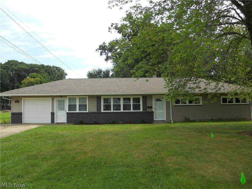 You'll Have To See It! The results of hours of hard work by the owner is evident in this 3 bedroom vinyl sided ranch! The large living room radiates hospitality and charm! Brand new kitchen gleaming with new cabinets /attractive counter tops and new stainless steel stove, refrigerator and microwave. Interior will satisfy the most particular buyer. Freshly painted with nice soft colors, new floor coverings throughout; replacement vinyl thermopaine windows; new exterior entrance doors including 6 panel raised interior doors and overhead garage door; attractive updated full bathroom and half bath; new roof shingles,facia and gutter; new furnace and central air and where do I stop? You will enjoy the large sun room along with fenced in rear yard. ALL REASONABLE OFFERS WILL BE CONSIDERED.  Stop by today, you'll be glad you did!