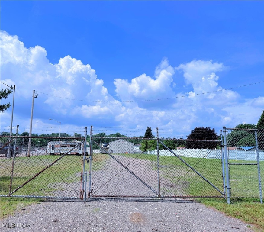 Unlock the potential of this versatile rare chance to own 1.1 acres of vacant commercial land in Plain Township. This land is completely fenced in and in a prime location perfectly situated for a wide range of business opportunities. The location is on Middlebranch 1/2 mile from Rt 62, next to AEP and across the street from Pro 1 Collision. Electric, Water and Septic are available at the street. The land has been used for storage, but the possibilities are endless. Whether you are looking to expand your operations, develop a storage facility, or use the space for truck and trailer parking, this property offers the flexibility and access you need. Please schedule a showing to walk the property, thank you.