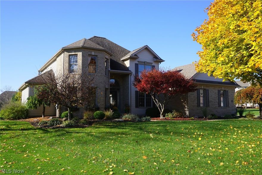 Hurry to see this wonderful St. James home on a cul-de-sac lot!  Fabulous open floor plan with 3,600+ total sqft, 4 bedrooms, 2.5 baths, and first floor master bedroom.  Open foyer leads to dining room, study and spacious great room with elevated ceiling and fireplace.  The open kitchen features maple cabinetry, breakfast bar and dinette surrounded in windows.  Master bedroom has private access to the patio, new carpet, full bath and large walk-in closet. Updated laundry room provides built-in "lockers" for easy storage. The finished lower level has two large recreation areas. Dark bamboo wood flooring throughout most of the home; new ceramic tile in laundry and bathrooms. New tiered, stamped concrete patio overlooks the beautiful yard with mature landscaping.  This is such a wonderful home in a very desirable North Canton neighborhood!