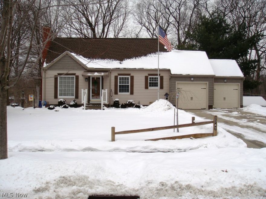 Charming 3-bed; 4-bath cape cod located on the Cuyahoga River! Main level boasts hardwood flooring and a cozy living room with beautiful ceramic tile wood-burning fireplace. Living area opens up into a nice-sized kitchen with oak cabinets; stainless steel sink; and newer countertops and stone backsplash.  Adjacent to the kitchen is a gorgeous dining room that opens up into a stunning family room with gas fireplace and sliding glass doors that lead out to a raised deck with breathtaking view of the river. Part of the deck is covered with an attached storage shed and patio below.  First floor master suite has an updated full bath; large walk-in closet; and access to the deck from sliding glass doors. Additional full, updated bath also located on the first floor. Second floor is currently being used as a large bedroom with full, updated bath with walk-in shower. Upper level also has two large closets for extra storage. Third bedroom and a full bath located in the walk-out lower level. Ext