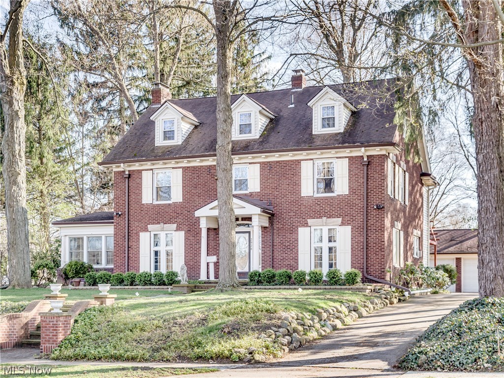 Step back into an era of quality & craftsmanship with this timeless classic all brick Colonial with Silver lake privileges! Situated on 1/2 acre ideally located on the Boulevard directly across from the beach/picnic area with beautiful lake views from almost every room. This century home has been lovingly maintained with excellence and careful attention to preserve its many charming and historic features. There's a grand entrance stepping through the Charleston leaded glass door into the vestibule with original tile floor and then french doors to spacious foyer. Charming features include vintage light fixtures, 7 sets of french doors, gorgeous hardwood floors, a bear claw bath tub, swan etched glass door,and natural wood custom crown molding throughout! The formal living room is 30 x 15 with a beautiful victorian fireplace that heats translucent glass stones for warmth. Windows surround the solarium where the sunlight fills the room and the lake view is magnificent! The formal dining