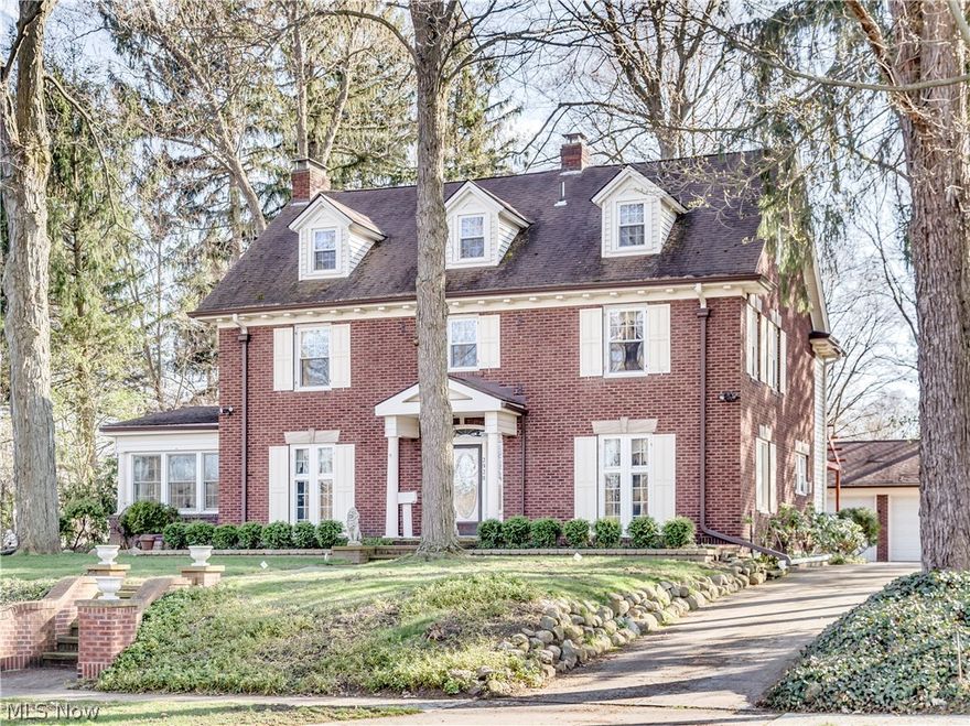 Step back into an era of quality & craftsmanship with this timeless classic all brick Colonial with Silver lake privileges! Situated on 1/2 acre ideally located on the Boulevard directly across from the beach/picnic area with beautiful lake views from almost every room. This century home has been lovingly maintained with excellence and careful attention to preserve its many charming and historic features. There's a grand entrance stepping through the Charleston leaded glass door into the vestibule with original tile floor and then french doors to spacious foyer. Charming features include vintage light fixtures, 7 sets of french doors, gorgeous hardwood floors, a bear claw bath tub, swan etched glass door,and natural wood custom crown molding throughout! The formal living room is 30 x 15 with a beautiful victorian fireplace that heats translucent glass stones for warmth. Windows surround the solarium where the sunlight fills the room and the lake view is magnificent!  The formal dining