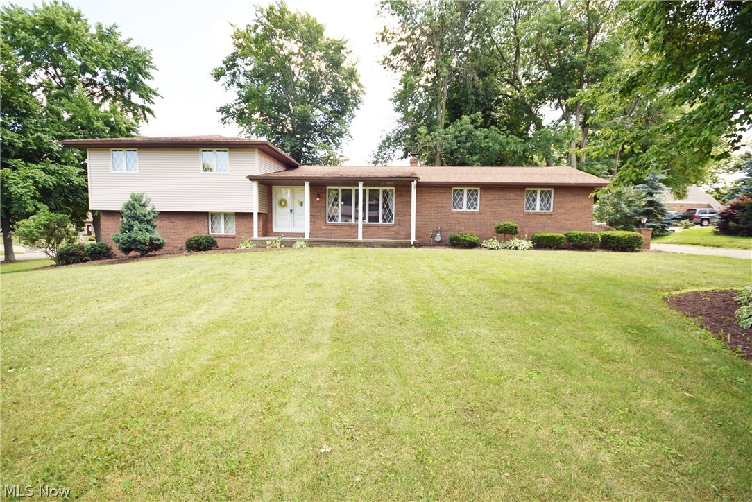 Spacious 4-Level Split with 2 Full Bathrooms on a large corner lot. Great floor plan with 3 bedrooms up and one bedroom down with full bath great for a master suite. Living room, family room with fireplace, rec room in the lower lever with bar, 3 season room off the family room, large patio on the back of the house and an over-sized side-load garage with hot/cold water. Attractive landscaping and a great setting. Priced to sell right away! Don't wait to call, call today and schedule your showing!