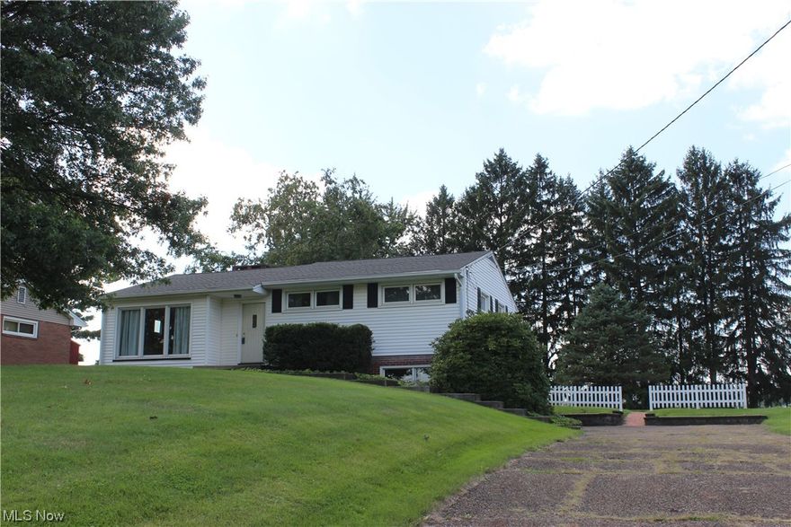 This one owner home has been well loved over the years, and now it's time for a new family to enjoy and make your own! Just a short walk to Veterans Park and walking trails, this affordable home offers 3 spacious Bedrooms with hardwood floors, a nice full Bath, and a fresh, neutral interior with original character highlighted throughout. The open Living Room gives a great mix of current decor/retro vibe, with newer windows that let the natural lighting spill into the space. The eat-in Kitchen offers a sunny view of the backyard with a galley Kitchen and ample room for your Kitchen table. Back door walks out onto a small back porch. Just a few steps down is the carpeted Family Room that can also be entered from the driveway, and attached 1 car garage. It has an additional unfinished basement storage space, crawl space under eat-in Kitchen, and a 1/2 bath. Many updates since 2010 and newer include replacement windows, roof, furnace and CAC, leaf guards, Kitchen appliances, water well, ba