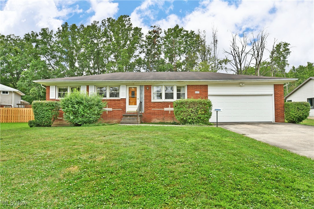 Put away your checklist, this Champion ranch has everything you’ve been looking for! All brick construction? Great schools and location? Large yard? Three-bedroom layout? Check. Check, check and check! Welcome home to your next adventure as you explore this potential packed residence. A cement drive leads to a two-car garage as lush landscaping marks the handsome brick façade. Inside, a spacious living room offers carpeted floors and plenty of natural light courtesy of the three picture windows. The jutting planter allows for easy floral accents as you open the decorative entry door. Nearby, a robust kitchen provides plenty of eat-in dining space that overlooks the array of wood cabinets. A hidden pantry adds to the allure. Down the main hall, a deep-set full bath highlights a tiled shower and brightly lit vanity. The trio of bedrooms excite with hard wood flooring and warm wood trim. A full basement is home to utilities, storage and a standalone commode for a secondary bath opportunity. Selling in "as is" condition.