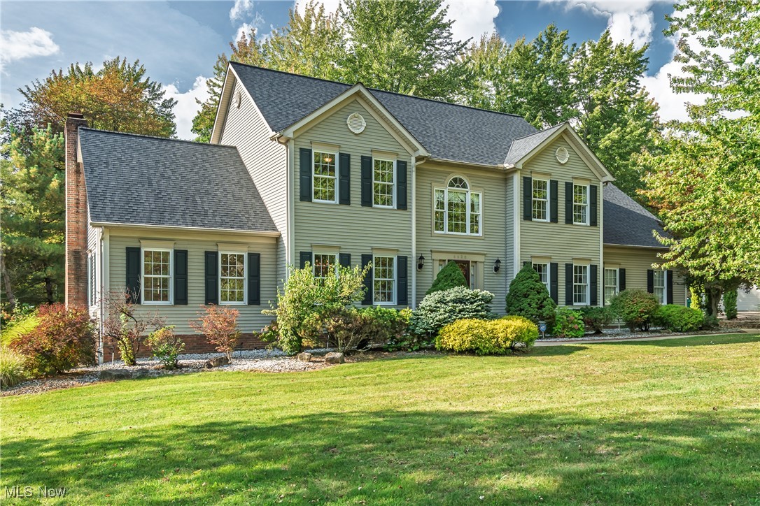 Stunning custom-built home located in desirable Oakpoint Commons near charming downtown Hudson. Quality built by MMMC Builders, 5 bedrooms, 4.5 baths, and a finished lower level. Beautiful maple kitchen featuring a large center island, hardwood floors, and granite countertops. Exquisite custom-painted moldings throughout. Formal dining room with gorgeous moldings and hardwood floors, and more beautiful molding in the living room. The kitchen opens to the Family room with custom plantation shutters and a handsome brick fireplace. French doors lead into the private office…would make a great playroom! Open floor plan with large entryways into all rooms. A two-story foyer features a turned staircase and hardwood floors. The second floor boasts a very spacious Owner’s suite with a private bath and large walk-in closet. Four more bedrooms and two full baths complete the second floor. The finished lower level offers three finished rooms, a wet bar, and a full bath, plus lots of storage. This special home sits on a private, nearly an acre, wooded lot. A large, maintenance-free deck was added to enjoy outdoor entertaining.
The high-end construction in this home is evident with the solid wood doors, the amazing custom painted moldings, the first floor 9 ft smooth ceilings, the wide plank hardwood floors w/silent flooring system, and double hung insulated tilt windows. New Roof 2024, New Hot Water Tank 2024, 3-car garage, central vacuum system, and sprinkler system.