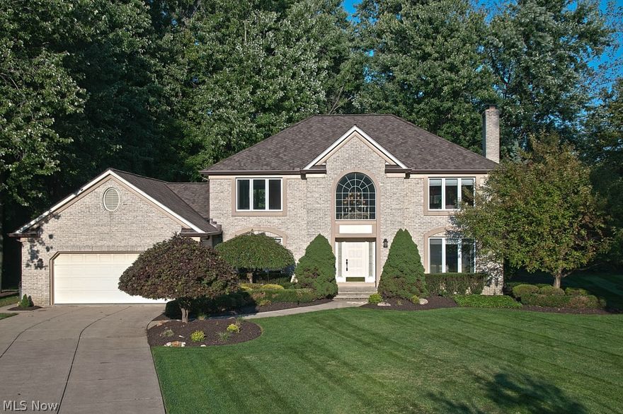 You'll feel captivated when you see all the special upscale updates throughout this 3,000+ sq ft 4bedroom 2 1/2 bath quality built Colonial on 1/2 acre lush private wooded cul-de-sac lot w/deck! An inviting 2-story foyer welcomes you w/lavish newer wood floors from the Exotic Collection that continue through the hallways, chef's Kitchen and family room. Family room features distressed custom hickory wood planks, intricate carved ceiling, built-in desk & glass door cabinetry. Entertaining & cooking is a delight w/ imported granite island in kitchen, SS appliances, generous eating area open to deck access & Great Room; It's easy to relax near the hand crafted grand gas fireplace w/intricate carving, inlaid granite & custom arched doors under wide hearth & mantle. Beautiful tray ceiling in formal dining room adds a touch of class to any event. The end of the day brings much comfort in the spacious master suite retreat with vaulted ceilings, private bath w/jetted tum & WI closet w/organize