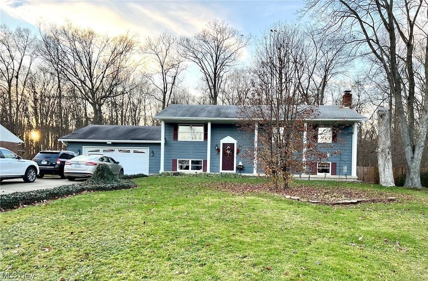 Do not miss your opportunity to visit this beautiful and well-loved home situated in a private neighborhood with lake access. This home features over 1900 square feet of living area including 4 bedrooms, plus a spacious bonus room that serves as a rec room or office space. A large family room with a fireplace, and the spacious living room make for wonderful living space in this home. This home also has two and a half bathrooms, the half bath was recently updated. The gourmet kitchen opens to the family room area, and has a large island, loads of counter space and newer appliances. The wonderful backyard paradise of the home is perfect for entertaining or family fun, and includes a 20x40 inground pool, large gazebo, extensive decking, and beautiful flowering shrubbery. There is also a newer 10x20 outbuilding with electricity for storage of pool accessories and more. The 2 1/2  car attached garage has lots of space and built-ins for storage. The possibilities for customizing the space and bonus room in the lower level are endless, just move in and make it your own. Appliances listed and window treatments stay with home. This home won't last on the market, schedule your showing today!