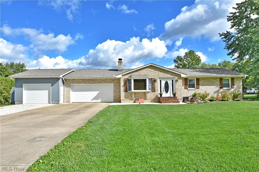 Start your next adventure with this gorgeous 3-bedroom Champion ranch, complete with a fenced in backyard and a stunning pool area!  Set in a desirable location on a prominent corner lot, this brick faced beauty immediately grabs your attention with its craftsman style shudders, front steps and an additional attached garage unit for vehicles or equipment storage. Around back, the oasis-like pool is surrounded by a cement pathway before transitioning into a raised wooden patio space. Inside, a bright and inviting living room to welcome you home with warm hardwood flooring and natural light cascading through the elegant entry door and nearby bay window. The illustrious combined kitchen and dining rooms await just across the main hall with tiled flooring, natural wood cabinet and a sun filled eatery that overlooks the backyard. A tastefully updated full bath is first down the hall, as the nearby guest bedroom brings carpeted flooring and cozy quarters. Opposite, the must-see master suite has been expanded to include a decadent private bath with soaking tub and offset shower with vanity. The walk-in closet is found opposite. Down below, a third bedroom with an attached full bath divide basement storage and laundry. There is nothing to do but move in here! Updates include new roof 2019, AC 2019, Furnace 2022, HWT 2021, electric service 200 amp, garage door 2021 and many more! Also offering a home warranty.