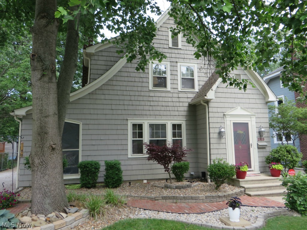 Absolutely charming Tudor home in very desirable area of Cuyahoga Falls. Stunning landscaping w/great open deck. True 2+ car garage and chain link fence around the back yard. You will love the sun room off the living room and the gas fireplace in the living room. Glass tiles in kitchen and 1/2 bath. Totally water proofed, new electric panel. Well done home with beautiful touches in every room.