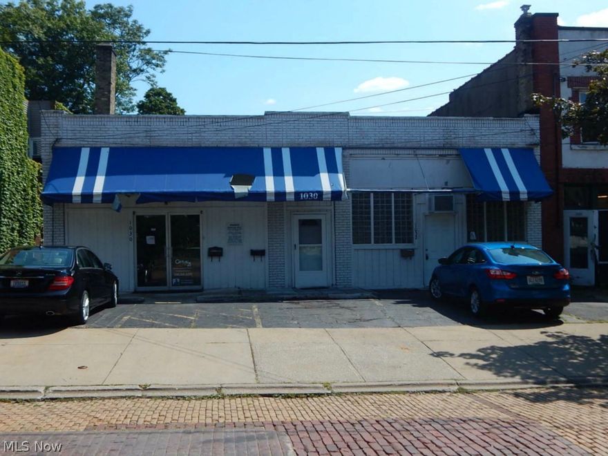 Great multi-use building to fit a variety of needs! One unit is set up as barber/beauty shop! The second unit is an efficiency apartment and unit three is nice-sized one bedroom, one bathroom second level apartment! Located in Highland Square - nice retail area! Great investment property! Call today to set up your private showing!  This property is now under auction terms.