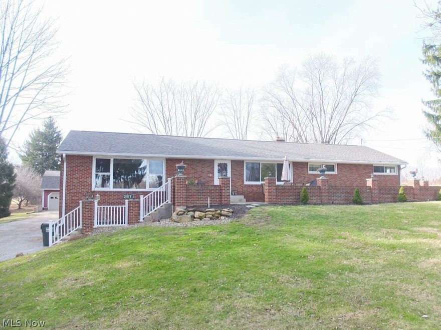 Wow! All brick 3 bedroom, 2 full bath raised ranch on 4+ acres! 2-car attached garage PLUS a 3-car detached garage! Detached garage has concrete floors, electric, newer doors and openers and attached dog kennel area. Spacious 24x22 great room off of the kitchen/dinette area. Updated kitchen with breakfast bar has seating for up to 6 people, stainless steel appliances, new countertops, ceramic tile flooring, tile backsplash, new sink and more! First floor office/den/hobby room off of the kitchen. Beautiful hardwood flooring in the living room, currently being used as a dining room. First floor laundry as well as basement laundry! Stunning 21x16 master suite has a walk-in closet, laundry room and a private full bathroom with tile floors, jetted tub and dual sinks. Bedroom 2 and bedroom 3 are spacious and the main bath has been completely updated too. Full, walkout basement offers ample storage, glass block windows and could be finished to your specifications. Wonderful sun room with vaul