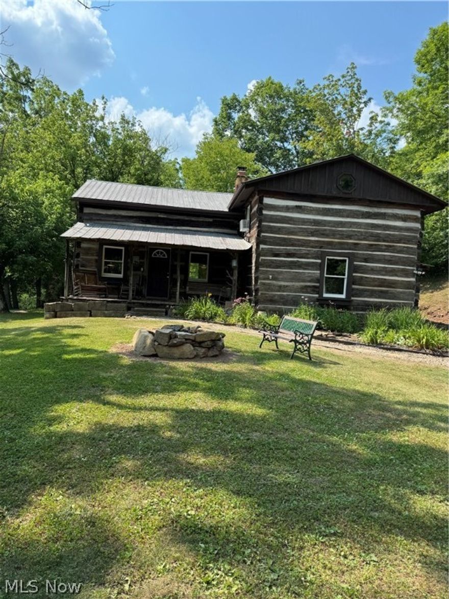 Every once in a while you list a property that you fall in love with and let me tell you about this one! The first 1884 log cabin was relocated from Nicholas County, the second one from 1834 was moved from Munday Road. The marriage of these homes have created a coziness seldom found. This beautiful place features an original stone fireplace that has a Buck Stove that can heat the entire home. The 9 acres can provide all the firewood you need and a river view. The home features a large eat-in kitchen, 3 bedrooms, 1 bath and a laundry room. The home has been updated with heat and air conditioning and public water. Whether swinging on the front porch or relaxing by the firepit, serenity can be yours. Come fall in love!