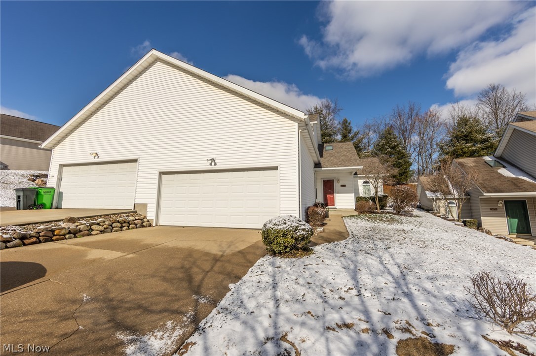 Welcome to this stunning condo in Tallmadge! When you step inside you are welcome by a flood of natural light from the skylight and sliding glass doors in the living home. You will love the vaulted ceilings in the living room, giving the space so much more volume. The living room opens to the dining room and kitchen, this whole area makes for the perfect entertaining space. The kitchen has beautiful oak cabinets with plenty of storage space. On the first floor there is a nicely sized bedroom/ home office and full bath. Upstairs has two additional spacious bedrooms, including the master with an en suite and walk-in closet. The whole condo has been freshly painted and has new carpet throughout. This condo will not last, check it out today!