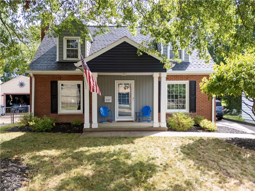 Fall in love with this storybook New England Cape Cod that blends timeless character with modern updates. Gorgeous hardwood floors flow throughout, and the cozy living room with fireplace creates the perfect spot to relax. Spacious formal dining room--perfect for family dinners and holiday gatherings. The first-floor bedroom and full bath add convenience, while upstairs you'll find two additional bedrooms and a beautifully remodeled full bath. The backyard is your private retreat--completely fenced with a large patio, built-in firepit, and space to entertain or simply unwind. A heated detached garage is the ultimate bonus for hobbies, a workshop, or just keeping your car warm in the winter. All the big-ticket updates are already done--new shingles, gutters, downspouts, electrical panel, waterproofing, furnace, A/C and more--so you can move right in with confidence. Prime location in West Akron near schools, parks, shopping, dining, and easy access to I-77 and downtown Akron. With great curb appeal, thoughtful updates, and plenty of charm, this is the move-in ready home you've been waiting for. Make it yours in time for the holidays!