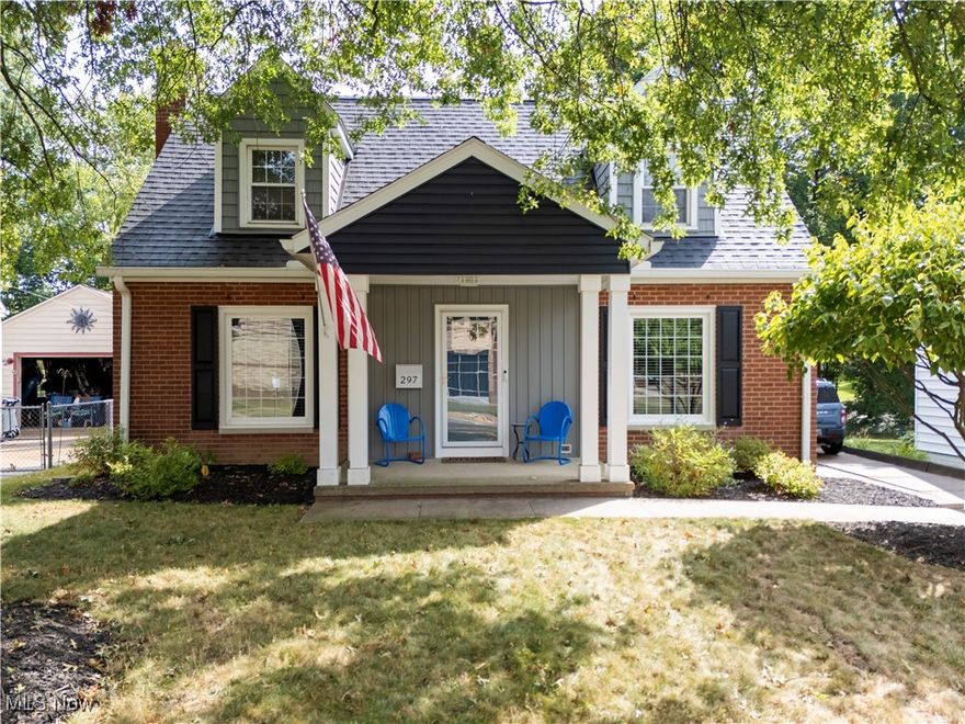 Fall in love with this storybook New England Cape Cod that blends timeless character with modern updates. Gorgeous hardwood floors flow throughout, and the cozy living room with fireplace creates the perfect spot to relax. Spacious formal dining room--perfect for family dinners and holiday gatherings. The first-floor bedroom and full bath add convenience, while upstairs you'll find two additional bedrooms and a beautifully remodeled full bath. The backyard is your private retreat--completely fenced with a large patio, built-in firepit, and space to entertain or simply unwind. A heated detached garage is the ultimate bonus for hobbies, a workshop, or just keeping your car warm in the winter. All the big-ticket updates are already done--new shingles, gutters, downspouts, electrical panel, waterproofing, furnace, A/C and more--so you can move right in with confidence. Prime location in West Akron near schools, parks, shopping, dining, and easy access to I-77 and downtown Akron. With great curb appeal, thoughtful updates, and plenty of charm, this is the move-in ready home you've been waiting for. Make it yours in time for the holidays!