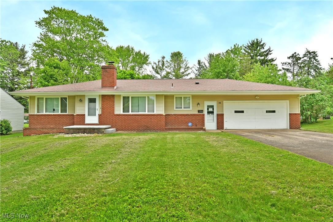 Kick off the summer right when you’re first through the door of this colorful and comfortable Niles ranch in Howland School District! Showcasing its desirable, three-bedroom layout while located in an advantageous neighborhood, close to local shopping, dining, and attractions alike, this home checks all the right boxes. The sizable property begins with a cement drive leading up to the two-car attached garage, while warm brick accents trim the front of the home. A fenced-in backyard offers privacy and security alike as it extends towards the tree-lined backstop. Step inside to find the welcoming living room with its tall windows and hardwood flooring. The brick-lined fireplace helps to divide the central dining room where you’ll enjoy plenty of natural light and front yard views. A serving window peers into the adjacent kitchen where robust, tiled flooring joins the complimenting backsplash and polished stone countertops. Along the main hall, a trio of spacious bedrooms are divided by a brightly lit full bath and its handsomely tiled shower. The sizable master bedroom offers great closet space along with the two additional bedrooms, with one offering an attached half bathroom. Down below, a full basement brings plenty of storage solutions, laundry services, and a half bath.
