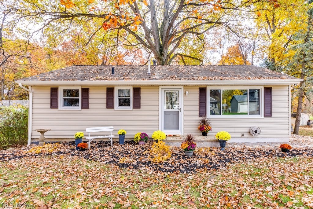 Welcome to your well-maintained ranch home in the heart of Stow with a finished walk-out basement. The home has been freshly painted throughout, the carpets cleaned, New carpet in the Rec room, Brand new fridge, and a new roof approximately 8 yrs ago, double deck, 30 yr shingles, approximately 5 yrs ago siding and windows were added. Brand new Man door walk-out basement, newer leaf filter gutters, and approximately 5 yrs ago, All new interior doors except for the coat closet. A new front paver walkway and new gravel were brought in for the driveway. At this price for a ranch in Stow, you don't want to miss out!