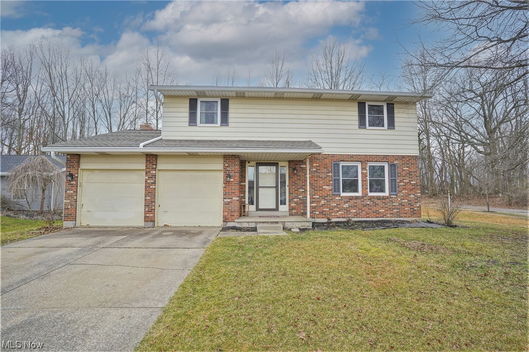 Amazing, spacious 4 bedroom home in an equally amazing neighborhood! Grab your agent and get here quickly! This beauty just had a new kitchen replaced within the past few years, complete with stunning cabinetry and gorgeous quartz counter tops! Top of the line vinyl plank flooring was added through the kitchen, hallways, and back family room, along with 2 bedrooms upstairs. Newer carpet was placed in the front living room and the dining room (which they currently use as an additional sitting area). All carpet in house is less than 5 years old. Step out of the family room onto your amazing stamped concrete patio (2022) with a hot tub (2021), gas lines for firepit and grill, all with a wall of trees along the back of the property for privacy! Also included is a large shed (2021) with metal roofing for all your garden and lawn care items. Upstairs features all the bedrooms. The main bedroom is massive! It also has a large closet and it's own bathroom. There are 2 full bathrooms and 2 half