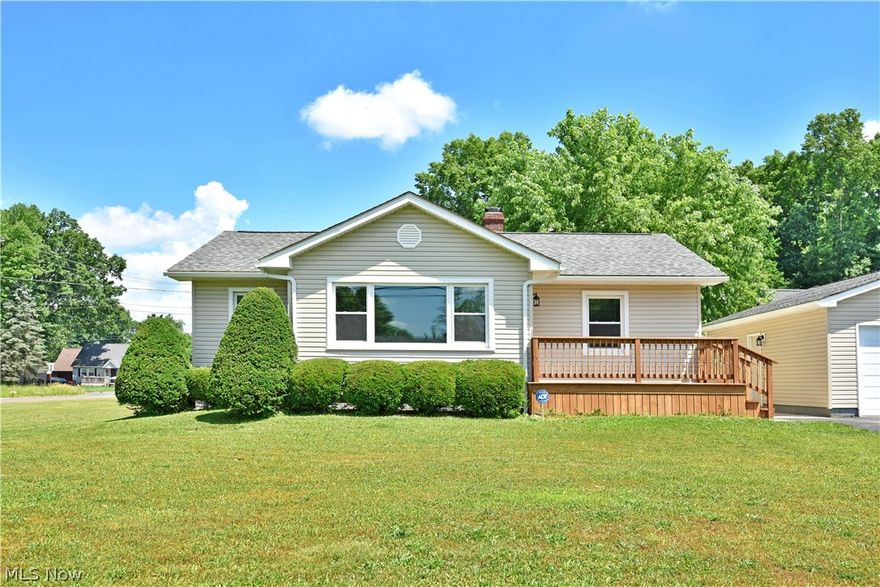 Beautiful, move-in-ready living space, an oversized detached garage and a massive plot of land await this potential filled Newton Falls home! This fantastic residence packs a big punch with its inviting three bedroom layout, complete with a full basement below. The soothing white and gray colors scheme pairs masterfully with the brand new natural color carpets as natural light pours in from the large living room picture window. Each of the bedrooms enjoys the same palate, adding in stained doorways for a warm accent. The main hallway contains built in cabinet and closet space along with a bright and bold, tiled full bath that showcases ornate hanging lighting and a stylish vanity. A robust kitchen enjoys new hardwood style flooring and modern, stainless appliances that join the long running, opposing countertops as natural wood cabinets are found above and below. Downstairs, utilities accompany lower laundry with plenty of room for dry storage. The 29 parcel lot (2.49 acres) also inclu